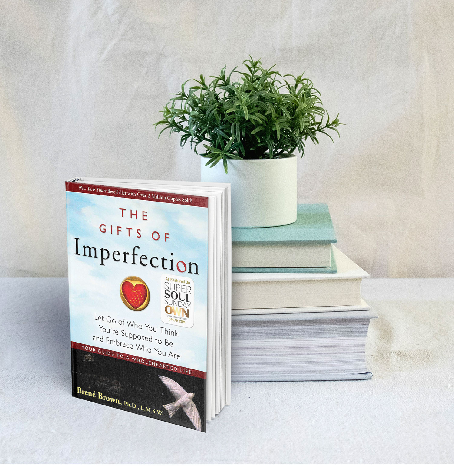 Stack of books and The Gift of Imperfection