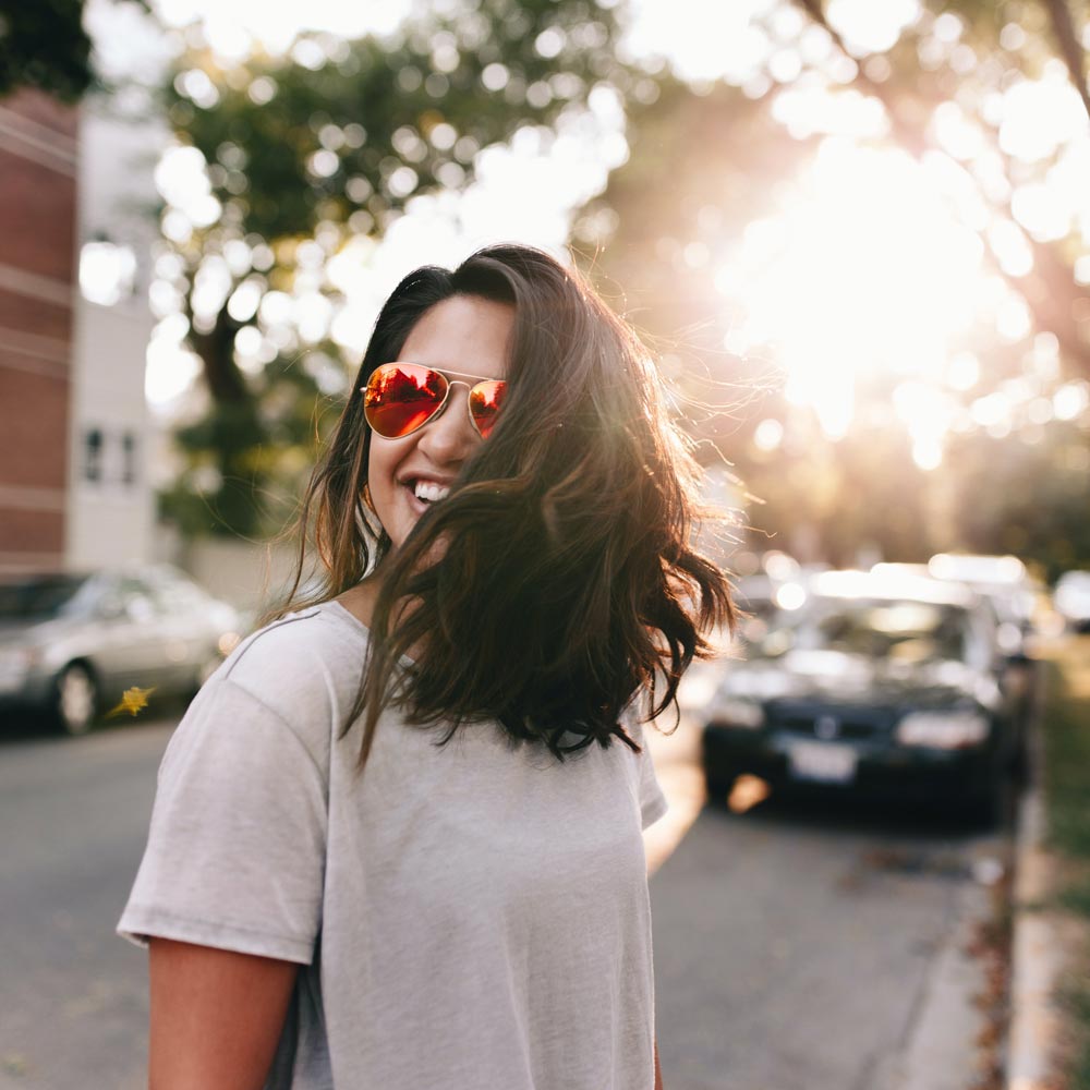Woman smiling with sunglasses