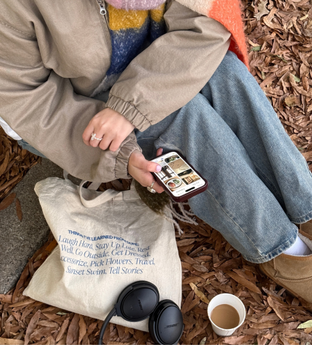 Image of woman holding her cellphone